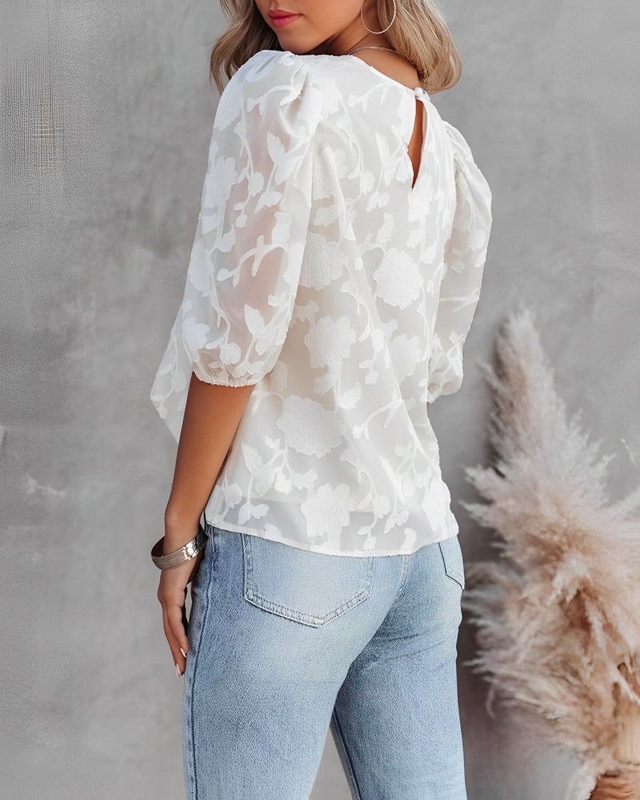 Blouse with puff sleeves and white floral pattern
