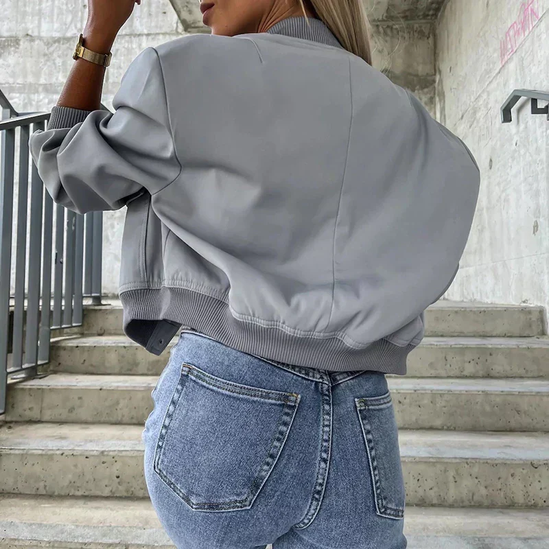 Short bomber jacket for women with flap pockets and snap closure