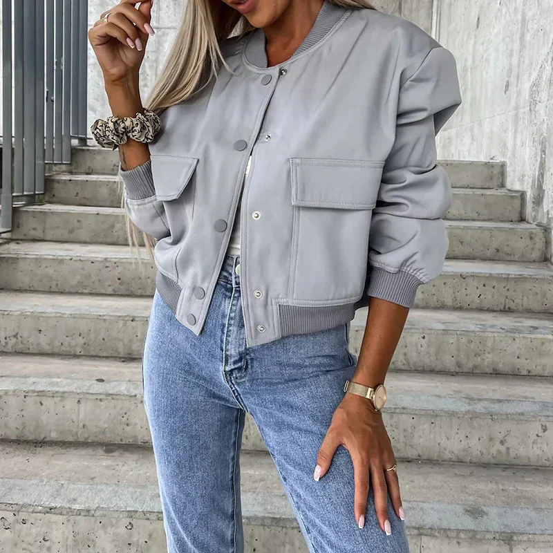 Short bomber jacket for women with flap pockets and snap closure