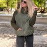 Steppjacke mit Strickärmeln und hohem Kragen