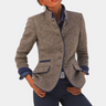 Women's fitted blazer with buttons and classic cut