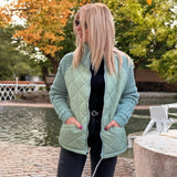 Steppjacke mit Strickärmeln und hohem Kragen