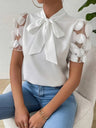 Elegante Bluse mit Schleifendetail und 3D-Tüllärmeln