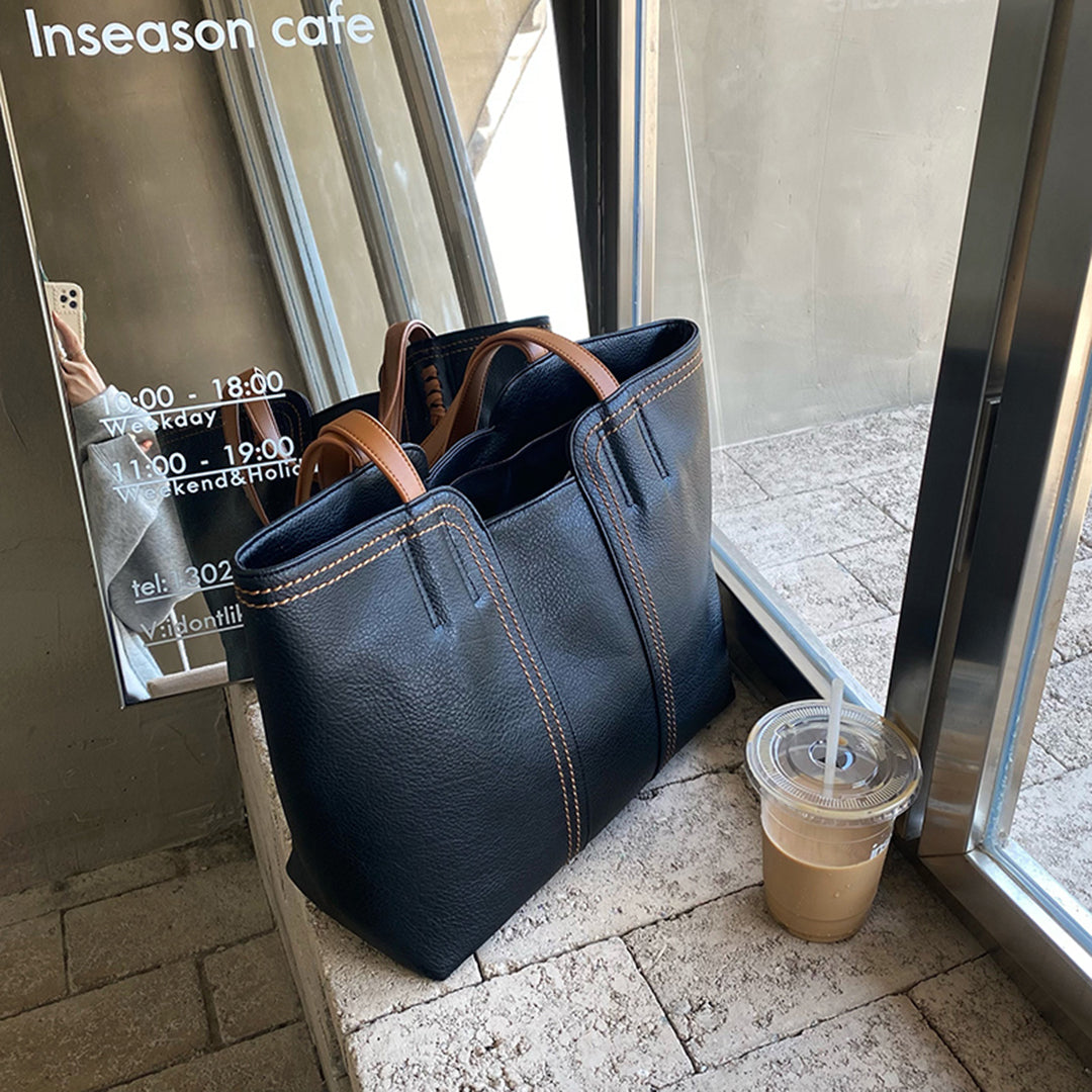 Elegante Ledertasche mit geräumigem Innenraum und mehreren Taschen