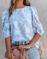 Blouse with puff sleeves and white floral pattern