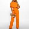 Eleganter Overall mit ausgestellten Beinen und geschnürter Taille