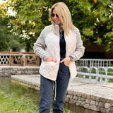 Steppjacke mit Strickärmeln und hohem Kragen